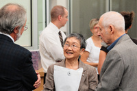 Margaret and Ed Lyons conversing with Patrick Deane, University President