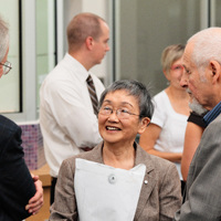 Margaret and Ed Lyons conversing with Patrick Deane, University President